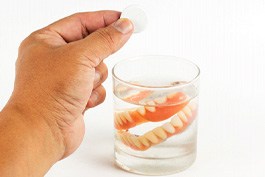 Dentures soaking in water