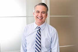 smiling businessman in his office