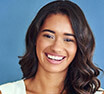 Lady in white shirt with luscious hair smiling