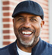 Man sporting cap smiling