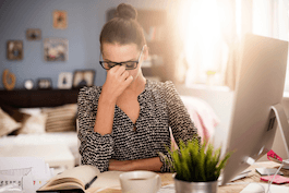 Frustrated woman holding the bridge of her nose