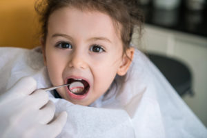 How can you set your child up for a lifetime of dental success? By seeing your family dentist in Peachtree Hills by the time they turn one year old.