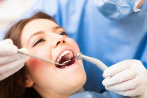 Woman smiling with dentist