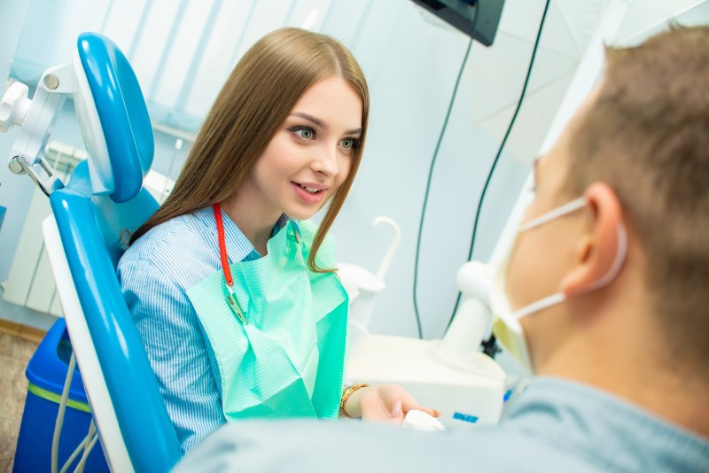 A patient speaking with a dentist in Buckhead.