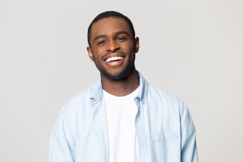 person with dental implants smiling