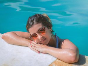 Woman relaxing in swimming pool